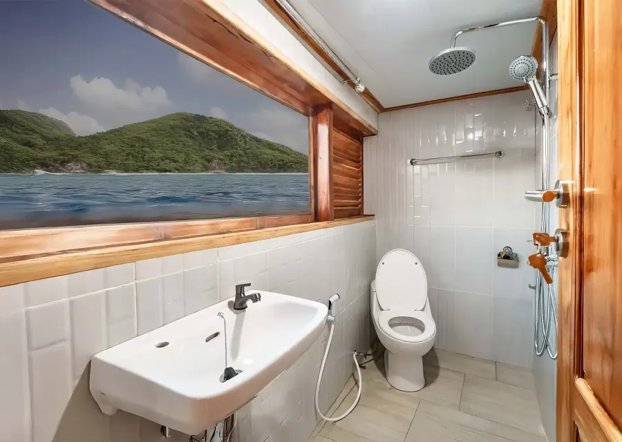 En-suite bathroom of the Master Cabin with a sea-view window