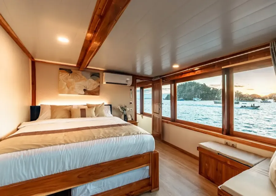 Master Cabin on Ayvara Cruise with queen bed and sea-view windows
