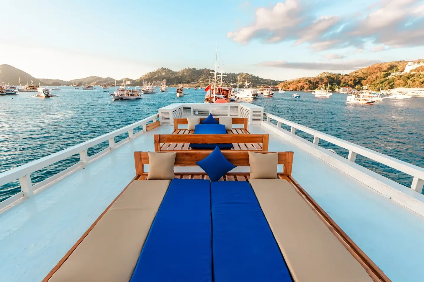 The 360-degree rooftop deck of Ayvara Cruise with sun loungers