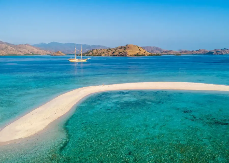 The Taka Makassar sandbar surrounded by shallow turquoise water